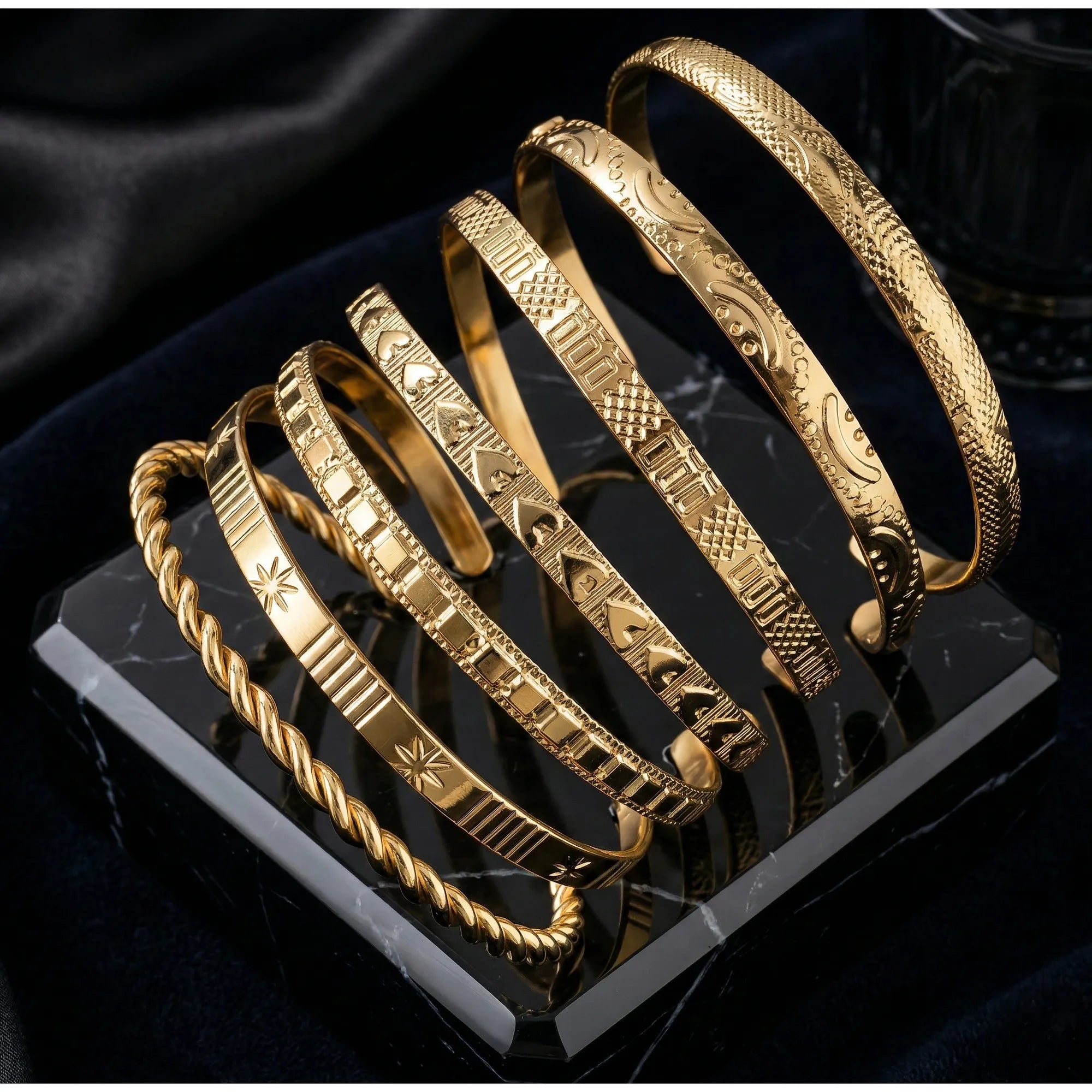 8-Piece Gold-Tone Textured Bangle Set with Twisted, Engraved, and Star Motif Designs